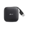 Acercamiento al diseño plegable del Hub TP-Link UH400, destacando cómo el cable USB se oculta de forma segura dentro del dispositivo para transportarlo fácilmente.